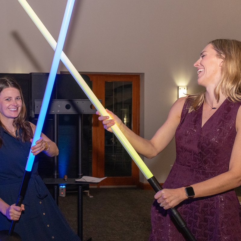 Guests laughing during a lightsaber duel at the Shift 2 Key Celebration